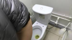 Click to play video Peeing in a public toilet bathroom