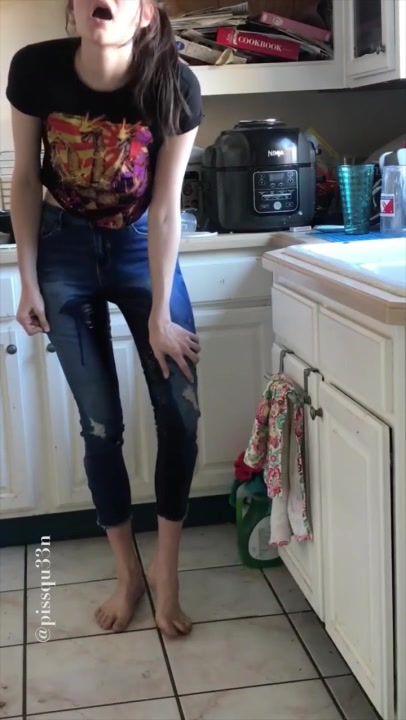 Click to play video Desperate jeans wetting while trying to finish doing the dishes
