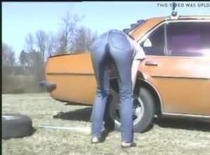 Click to play video Girl piss jeans changing tire