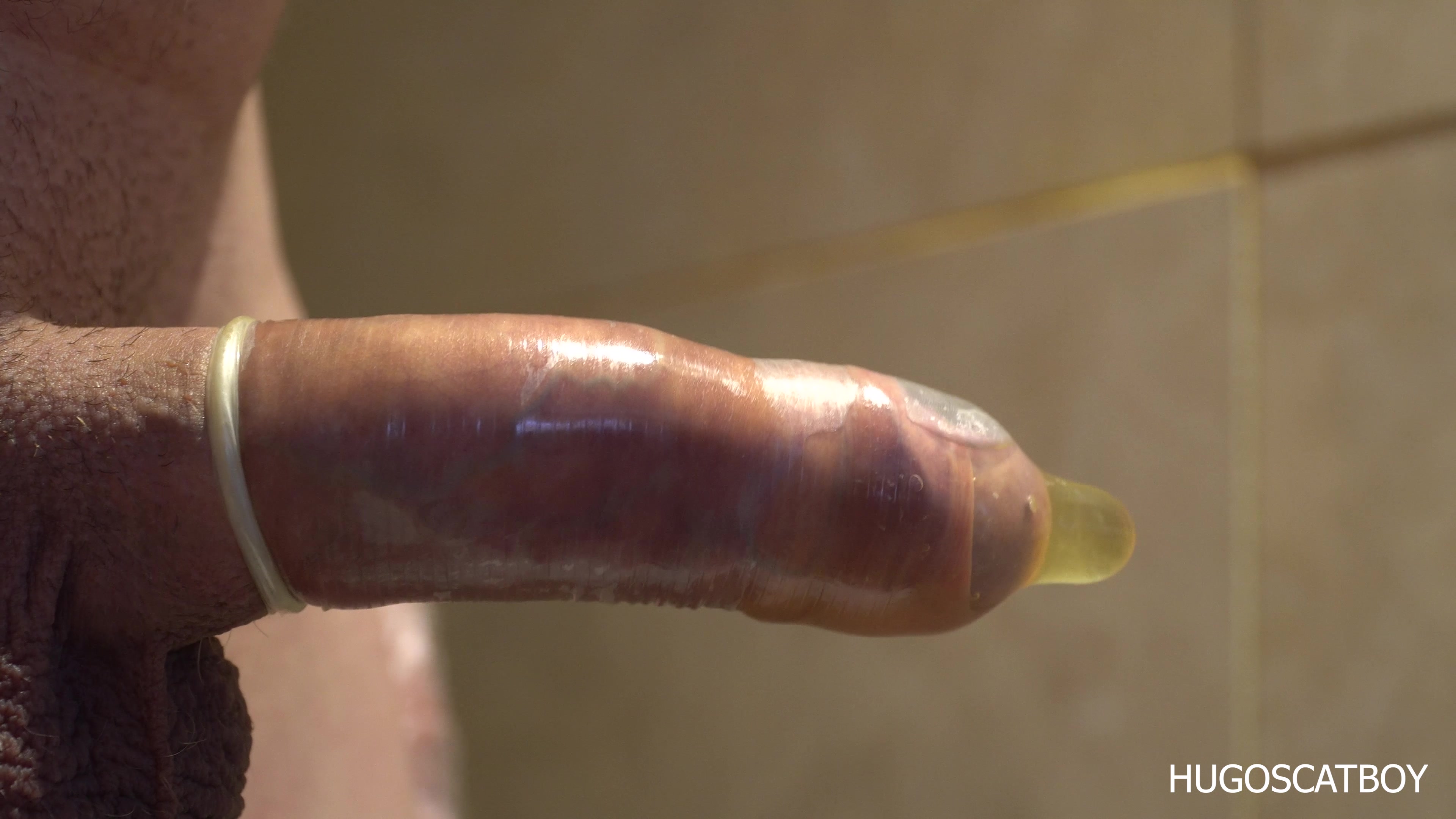 Click to play video HUGOSCATBOY FILLING CONDOM WITH PISS E1 CLIP 1