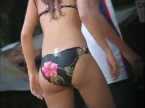 Click to play video Girl pees bikini on beach