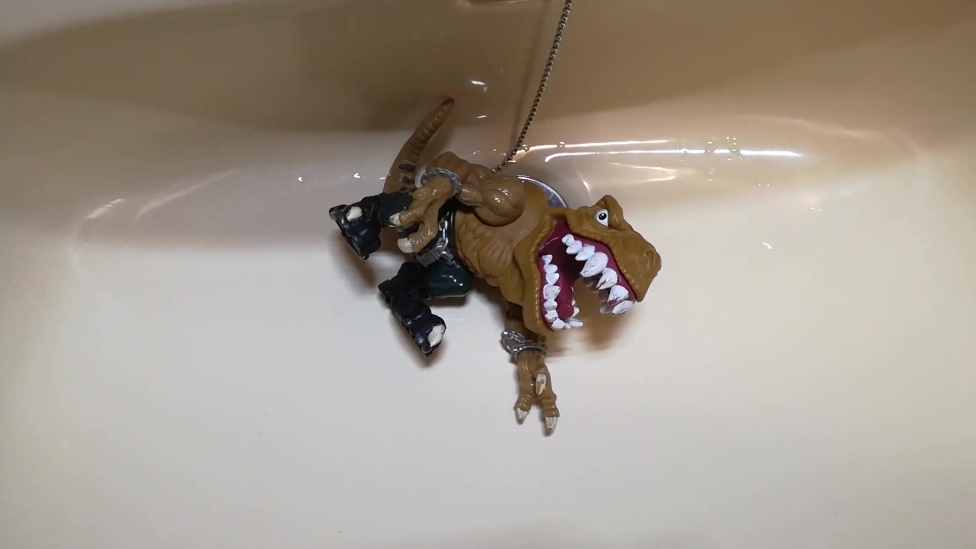 Click to play video Dinosaur T - Bone gets a golden shower