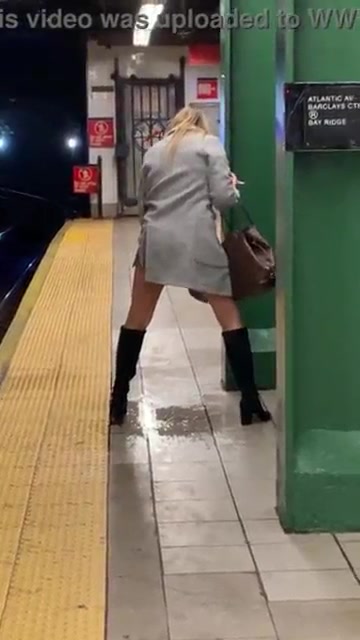 Click to play video Careless Woman pissing on subway platform