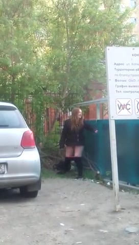 Click to play video Drunk Russian woman gets caught peeing near a building site