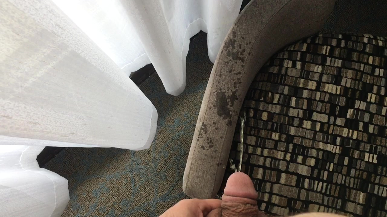 Click to play video Pissing on hotel chair